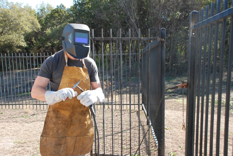 2011-12-30-Justin welds our fence-04.jpg